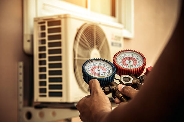 Professional Air Conditioning Service technician working in Holladay, UT